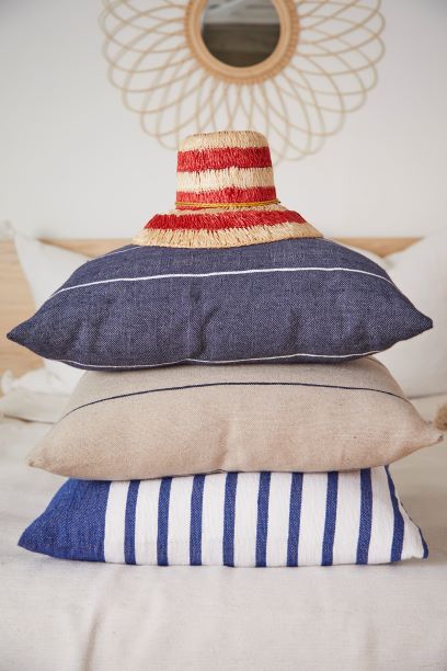 3 colorful pillows piled up
