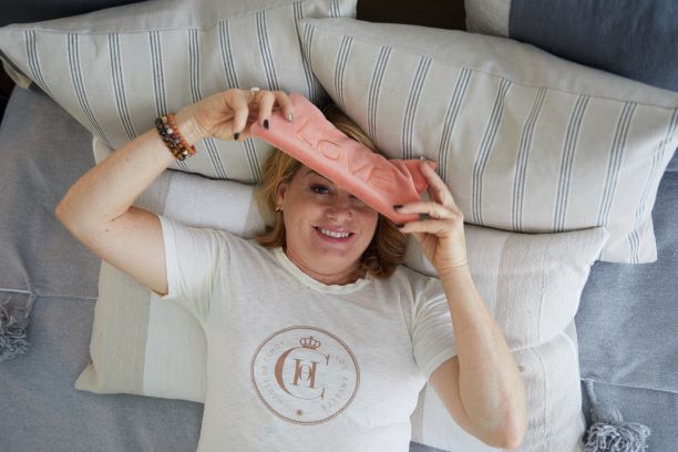 woman holding eye pillow